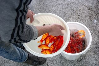 The fish seller try to count fishes before sale.