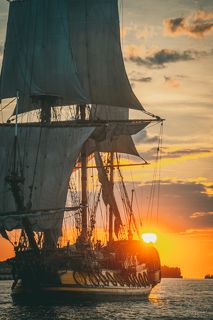 The Frigate Shtandar in calm weather sailing sunset time Riga Latvia