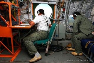 Борт инженер и конструктор Бе-200 из КБ им.Бериева работают над совершенствованием самолета.