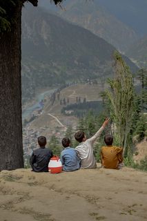 The child in the picture sitting in solitude looking at the beautiful view in front of me and being in thought prompted me to paint it.
The arrival of his friends moments later and the rapid change in the child\'s mood before their presence gave me the opportunity to create this series.