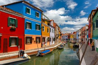 Canal with colorful houses on the famous island Burano, Venice, Italy