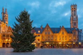 Picturesque night medieval Christmas Burg Square with Christmas tree in Bruges, Belgium.