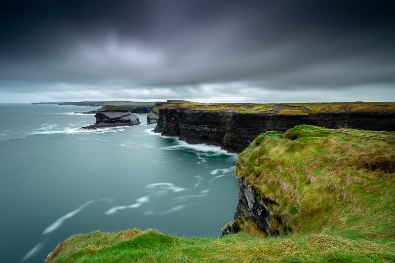#landscape #waterscape #dynamic #sky #clouds #stones #ireland #canon #longexposure #nature #beautiful #colorful #cliff Kilkee Cliffsphoto preview
