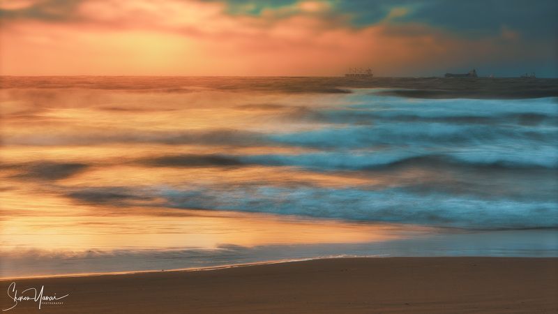 wave, waves, ocean, sea, beach, sunset, romantic, golden, color, orange, warm, cargo, ship, landscape, no people, background Waves at the beach the ocean at sunsetphoto preview