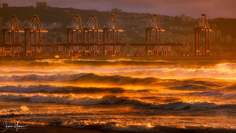 cargo, port, sunset, wave, waves, ocean, sea, mountain, city, industrial,  Cargo port at sunset with golden wavesphoto preview