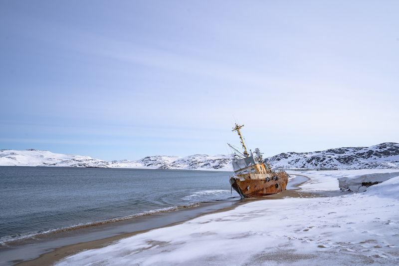 tundra; transportation; graveyard of ships; cloudy sky; tourism; beautiful; russian; outdoor; scenery; peninsula; barents; ocean; background; arctic circle; arctic ocean; bay; kola; northern; fishing boat; aurora; russia; ship; landscape; kola peninsula;  broken vessels on the coast of the Barents seaphoto preview