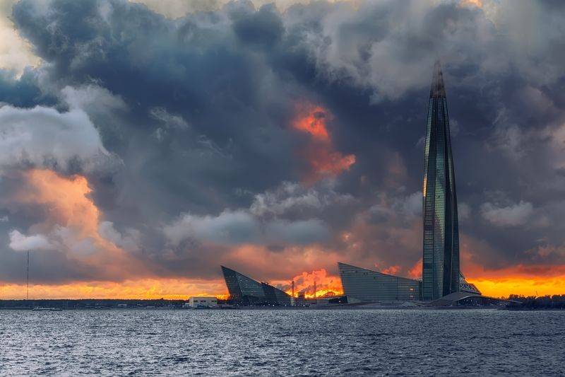 город море вечер закат небо облака ненастье архитектура башня Дождливый деньphoto preview