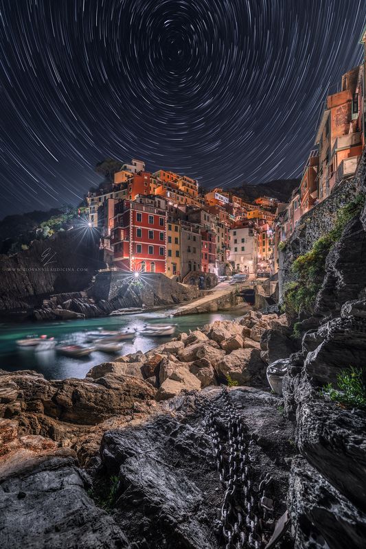italy, liguria, cinque terre, riomaggiore, la spezia, mediterranean, unesco, village, town, long exposure, sea, sky, light, panorama, coast, landscape, amazing, scenic, travel, destination, star trail, stars, night, nighscape, Stars Vortexphoto preview
