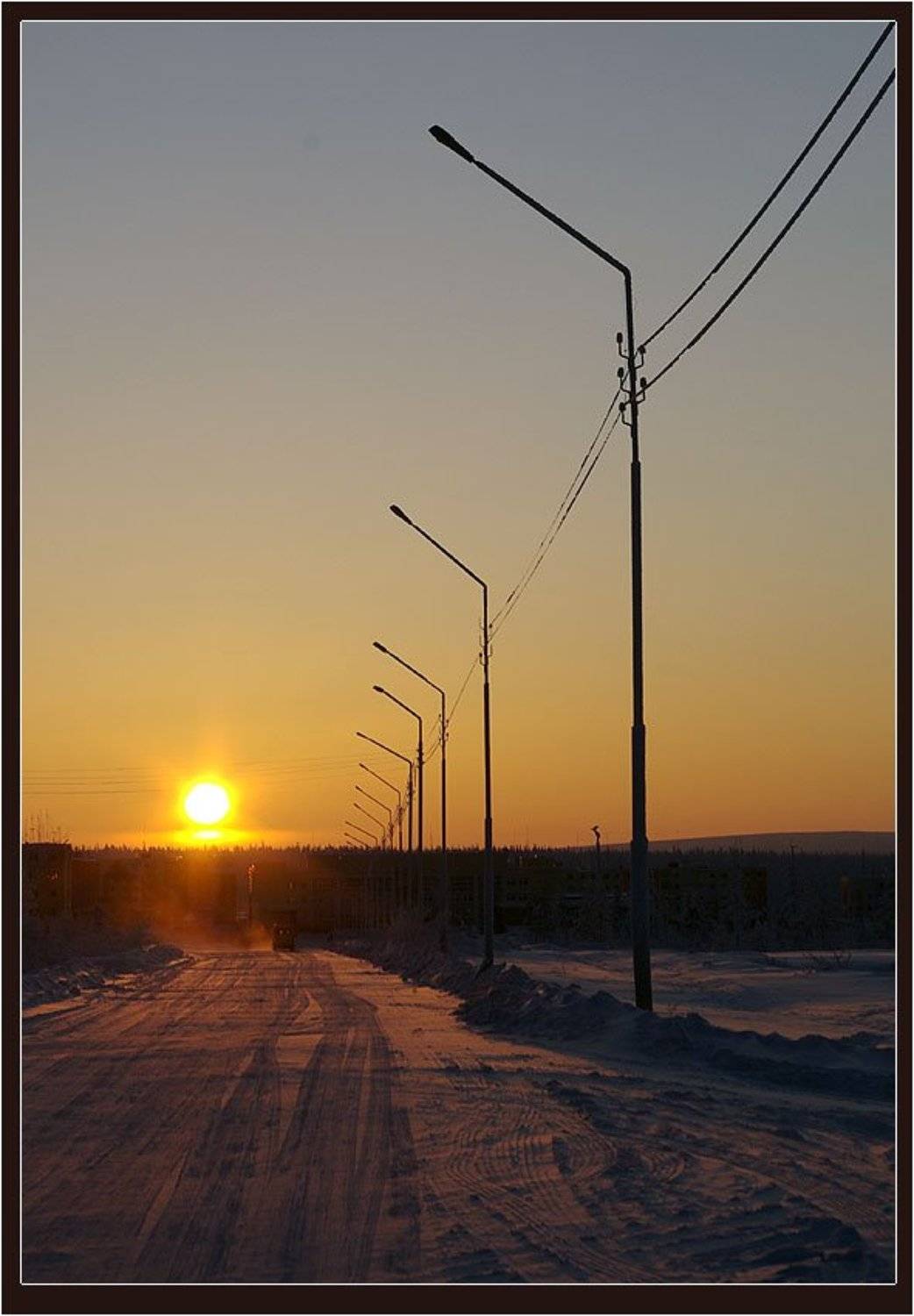 Уходящее солнце. Автор: Солодухин Виктор закат,зима,город, Солодухин Виктор
