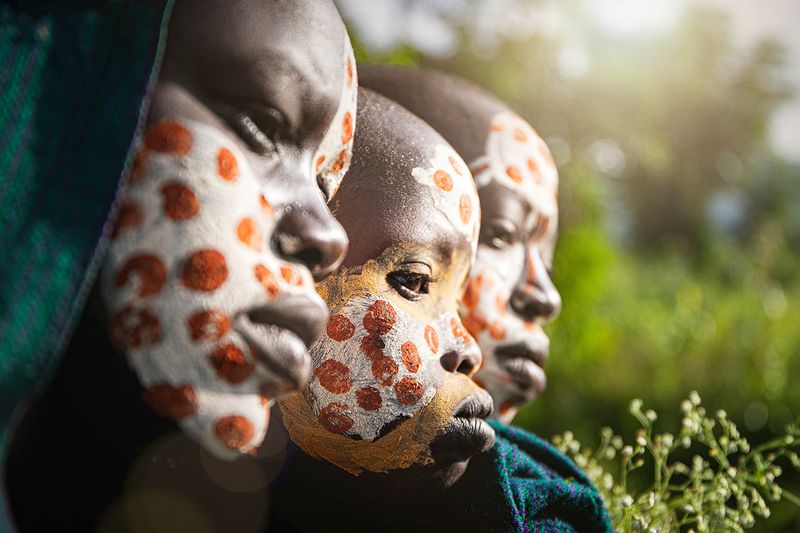 ethiopia,tribe,tribal,suri,omo valley,omo,face paint,painted,face painting,bokeh,face,ethnic,african,africa,africans,documentary,portrait,spots,dots,native,indigenous Three Surmaphoto preview