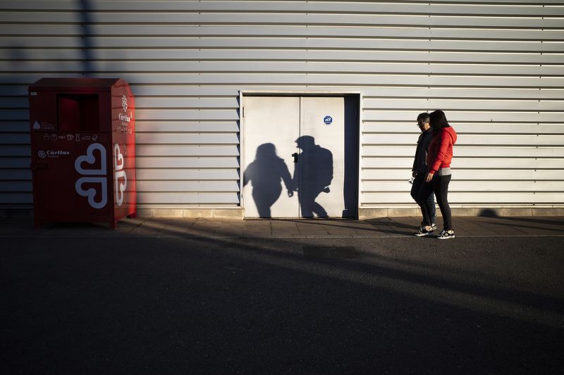 streetphotography, streetphoto, urban, people, street life,shadow, low key, street photo, street photography Two shadows at the doorphoto preview