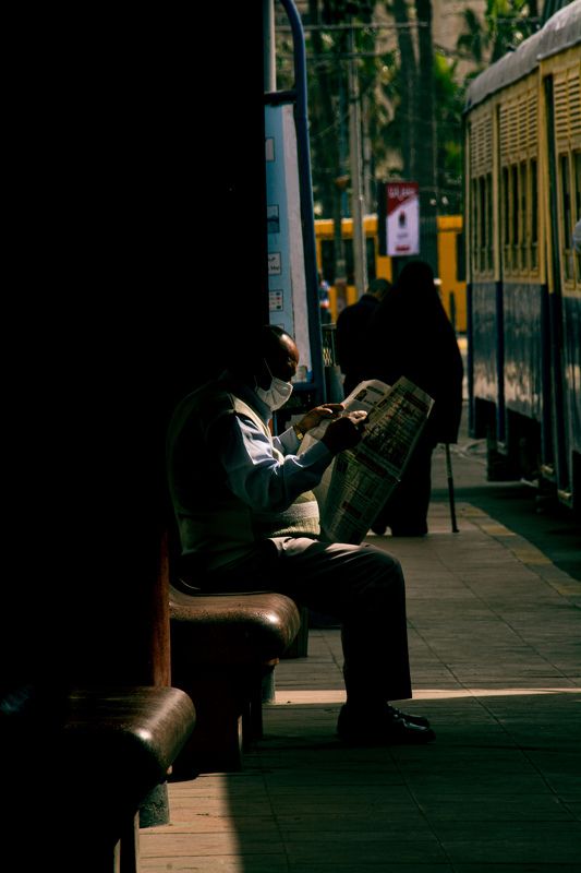 shadow, , people,   street,    street photography,    awards, reading reading in the darkphoto preview