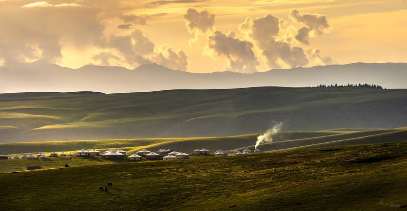 Smoke is curling upward from kitchen chimneysphoto preview