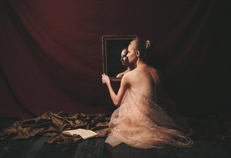 Woman with book and mirrorphoto preview