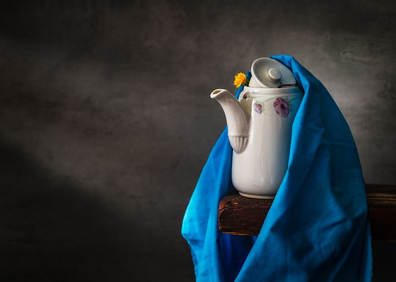 Still Life Staffordshire ceramic teapot yellow flower blue fabric natural light Portrait of  Staffordshire Teapotphoto preview