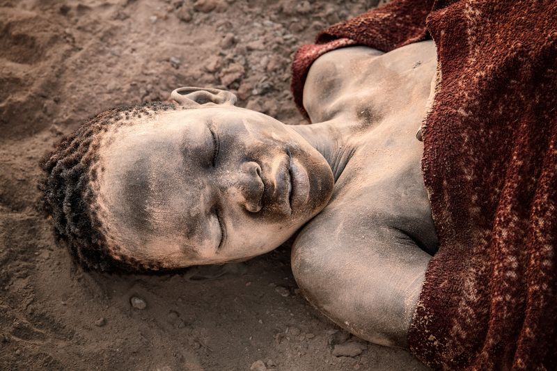 Mundari, cattle camp, South Sudan, culture, portrait Asleep by his cattlephoto preview