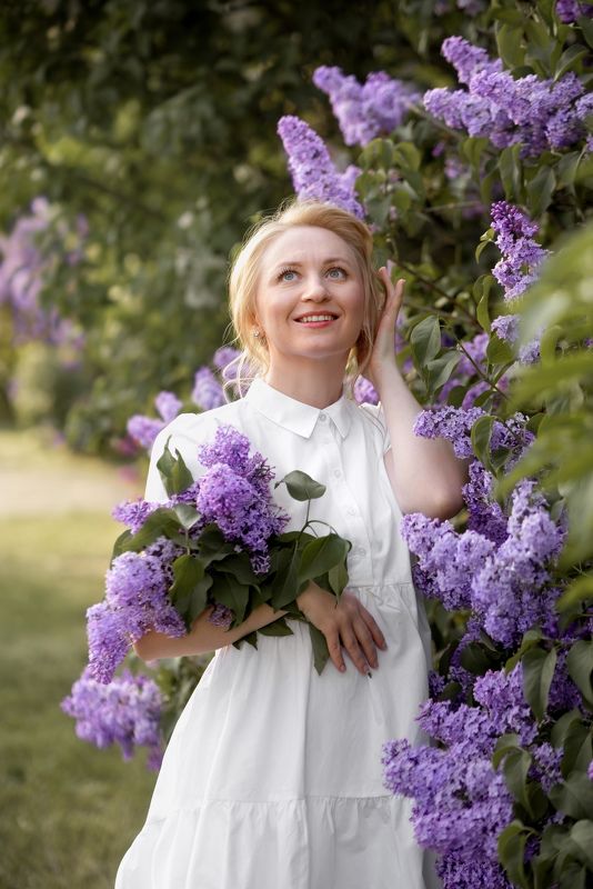 zhenskiy, portret, young, girl, with, a, bouquet, of, lilacs, white, dress, blonde, knitted, sweater, gathered, hair, muted, green, female, portrait Девушка в сирениphoto preview