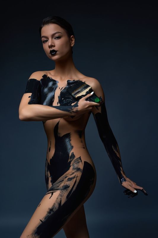 woman; sensual; naked; sexy; smear; black; paint; nude; bodyart; dark; erotic; body; female; seductive; model; young; studio; slim; creative; allure; figure; grace; undress; intimate; sexual; tender; temptation; topless; dye; fantasy; pigment; artist; pro sensual slim young naked woman standing in dark studio and paint black color  фото превью