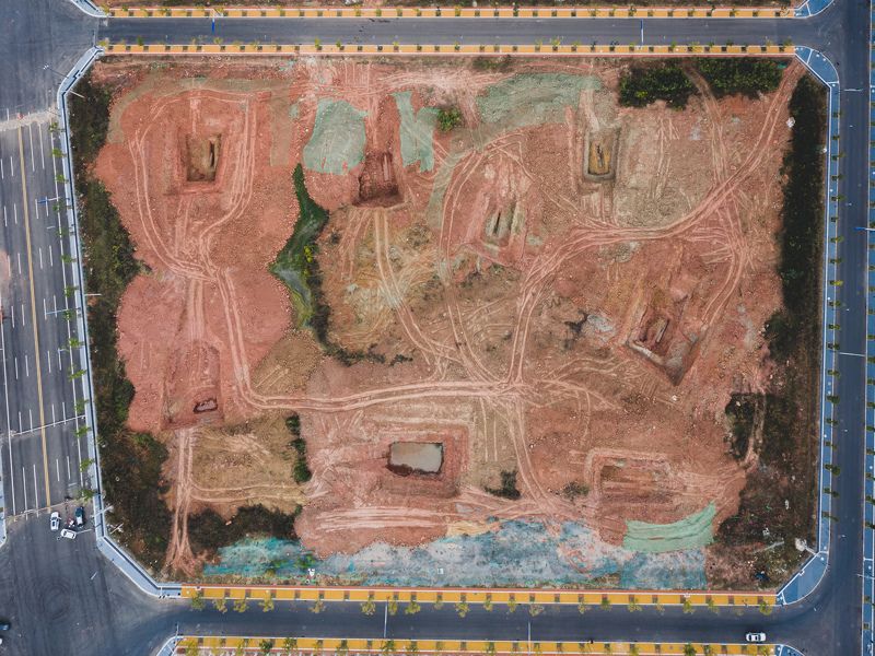 cemetery, graves, holes, channels, pit, water, pool, land, soil, dirt, red, reddish, square, district, new, road, street, city, weird, crazy, underground, subterranean, geometric, abandoned, deserted, cracks, circular, swamp, construction Ancestorsphoto preview