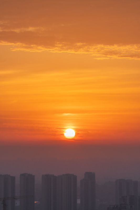 urban sunrise, mesmerizing colors, fiery orange hues, ethereal blue-purple, sunrise cityscape, tall buildings, urban dreamscape, metropolis at dawn, captivating skyline, luminous red lights, spellbinding visuals, city awakening, fiery orange and blue-purp Dawn\'s Urban Palettephoto preview