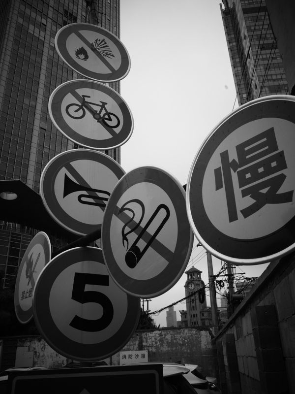 urban landscape, modern architecture, traffic signs, glass buildings, speed limitation, safety regulations, restricted areas, no smoking sign, watchtower view, prohibited activities, controlled environment, city skyline, limitations in place, building fac Vivid Urban Dynamismphoto preview