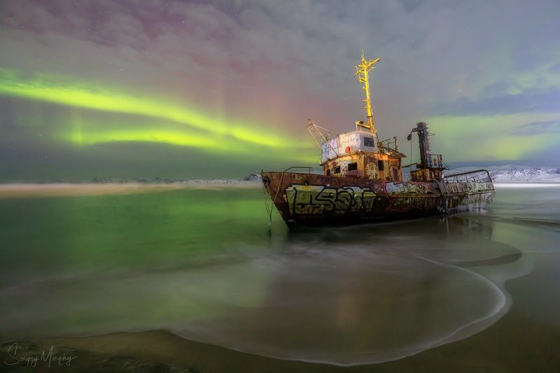 Northern lights over ship wrack. Teriberka.photo preview