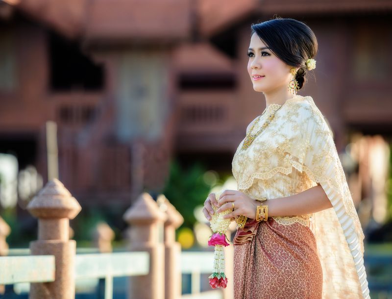thai; woman; thailand; girl; outdoor; greeting; charming; attractive; ornament; cloth; jewelry; flower; tender; silk; culture; enchantress; buddhist; folk; dance; female; fashion; polite; fabric; portrait; elegant; outfit; nice; tradition; colorful; forma Beautiful Thai girlphoto preview