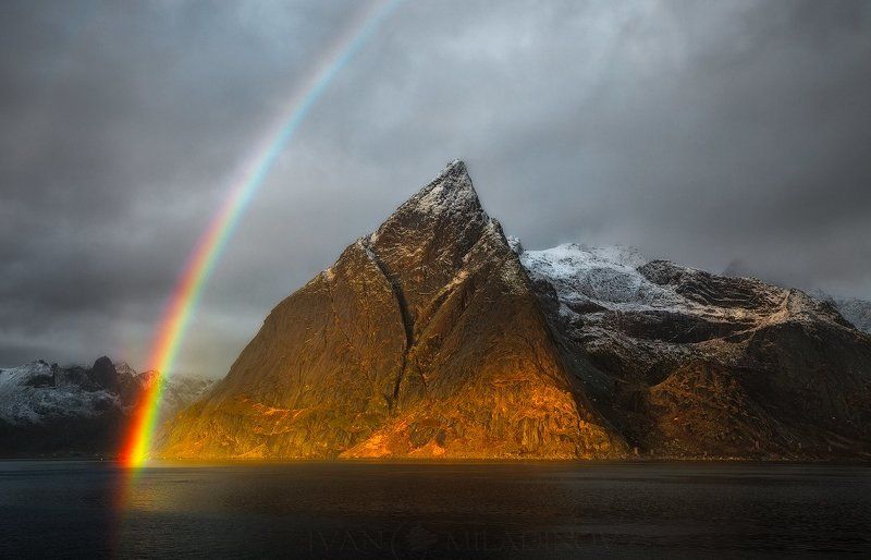 lofoten, norway, polar circle, rainbow, peak, sunset, snow Stormy rainbowphoto preview