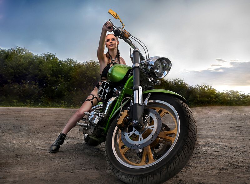 The girl is a motorcycle racerphoto preview