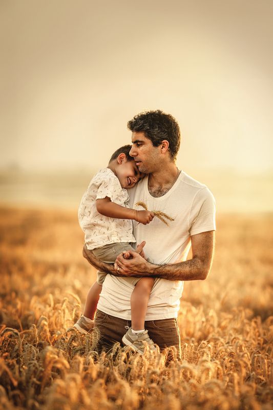 Father and son in a wheat fieldphoto preview