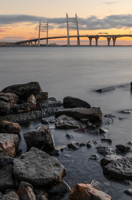 мост, bridge, питер, санкт-петербург, петербург, залив, bay, камни, вода, water, город, city, закат, sunset, облака, небо, cloud, sky Современный мост Петербургаphoto preview
