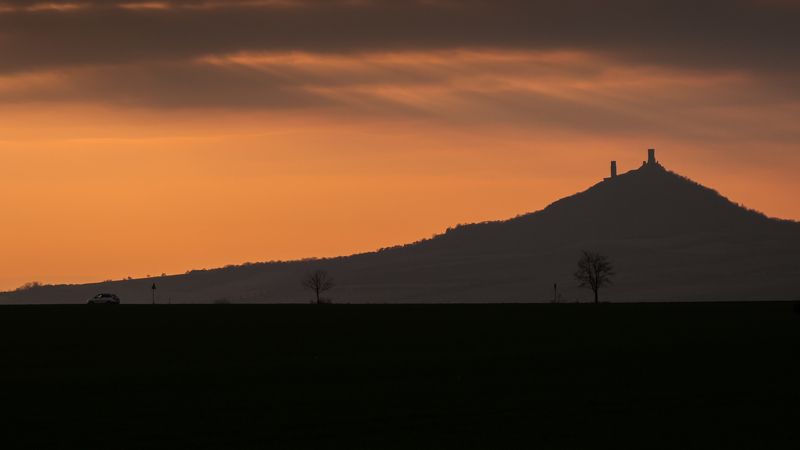 castle,czechia,hazmburg,landscape,sunset,car,story,minimalism Under the castlephoto preview