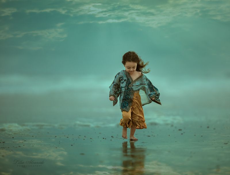 water,reflection,girl,walking,wind,windy,blue,marine, brunette,flow,beach,smiling,candid Feel The Windphoto preview