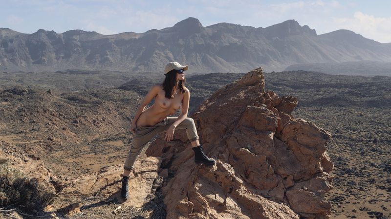 artistic nude, beauty in nature, body confidence, desert, explorative mood, modern muse, mountains, natural aesthetics, one person, outdoors, pensive look, pose, rocks, sensual elegance, side view, sky, standing, tranquility, visual contrast, young woman Conquering Heightsphoto preview