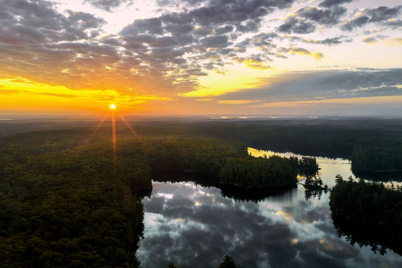 goodmorning ,naturelover ,photography ,wanderlust ,getoutside ,sunrays ,island ,aerial ,viewfromabove ,travel ,explorecanada ,canadianlandscape ,serene ,quiet ,calm ,relaxing ,tranquil ,peaceful ,earlymorning ,goldenhour ,sunrise ,forest ,lake ,reflection Sunrise Over Tranquil Forest Lakephoto preview
