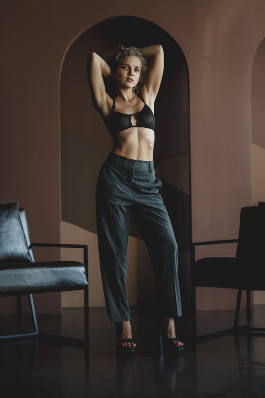 fashion, editorial, style, arch, architectural, terracotta, warm, tones, elegant, confident, pose, crop, top, high, waist, pants, minimalist, clean, lines, contemporary, modern, xena, model, sophisticated, chic, geometry, framed, composition Xeniaphoto preview