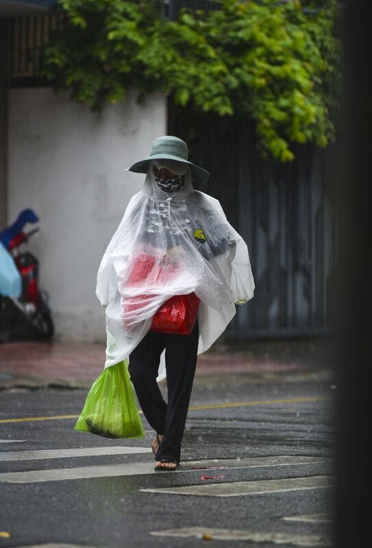 Raincoat on the VietNam streetsphoto preview
