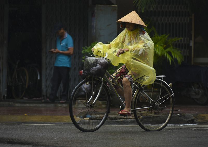 Raincoat on the VietNam streetsphoto preview