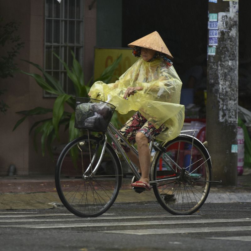 Raincoat on the VietNam streetsphoto preview