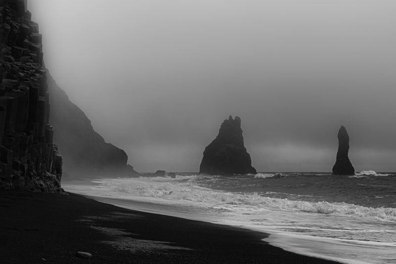 blackandwhite, islandia, landscape, bnwlandscape, fineartphotography, landscapephotography, seascape, minimalism, naturephotography, timeless, silence, solitude, impermanence, stillness, atmosphere, mood, rockformations, coastline, volcaniclandscape, seaa Basalt Guardiansphoto preview
