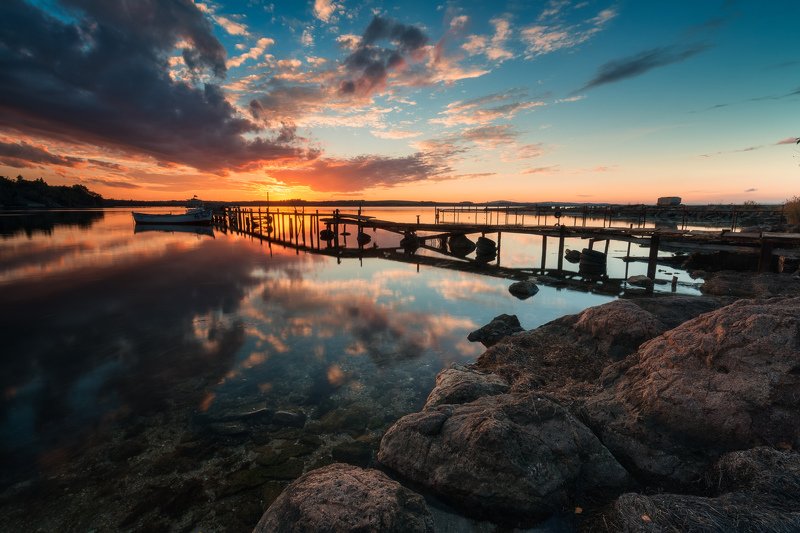 sun, sunset, sea, sky, water, reflection, boat, pier, shore, rocks, clouds, colors, travel, nature, golden hour, Sunset reflectionphoto preview