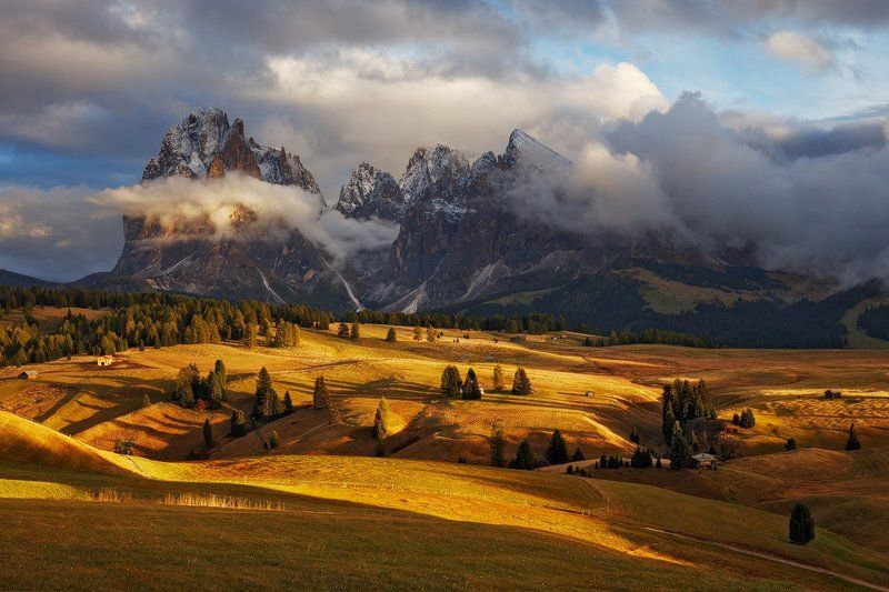 dolomites, dolomiti, italy, light, autumn, fall, evening, meadow, trees, huts, landscape, nature, alps, mountains, sassolungo, peaks Clouds Have Brokenphoto preview
