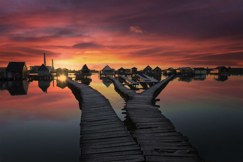 lake, huts in water, sunset, water, clouds, colors, reflections Fishing huts at sunsetphoto preview