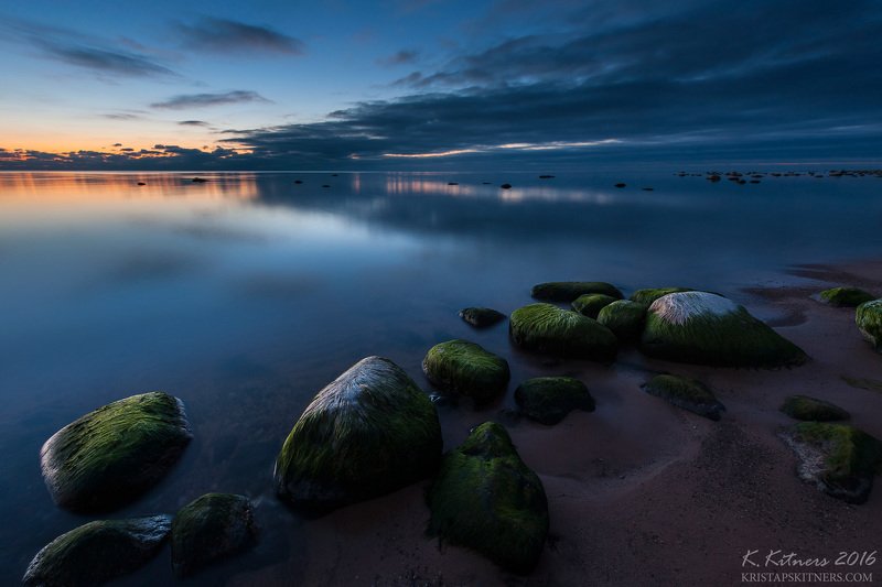 sea seascape water sky clouds stone reflection sunset evening latvia Silencephoto preview