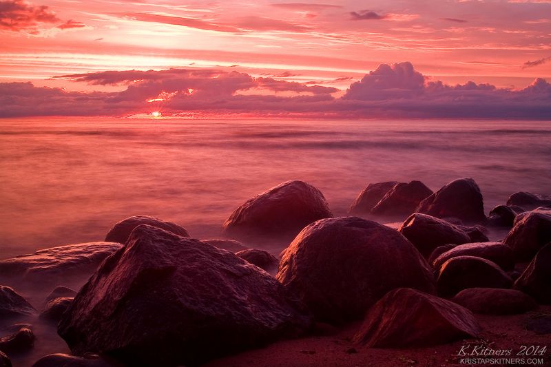 sea seascape water sky clouds stone reflection sunset evening latvia Pink And Redphoto preview