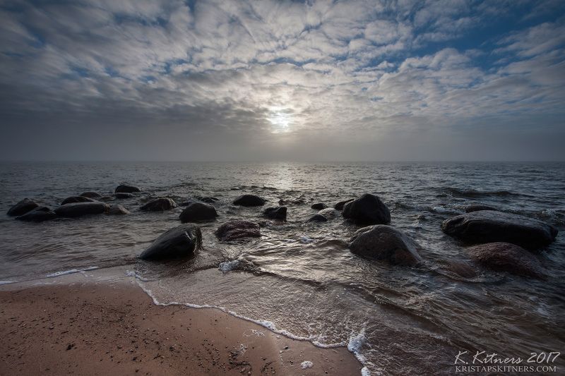 sea seascape fog smoke sun light water sky clouds stone reflection latvia The Foggy Lightphoto preview