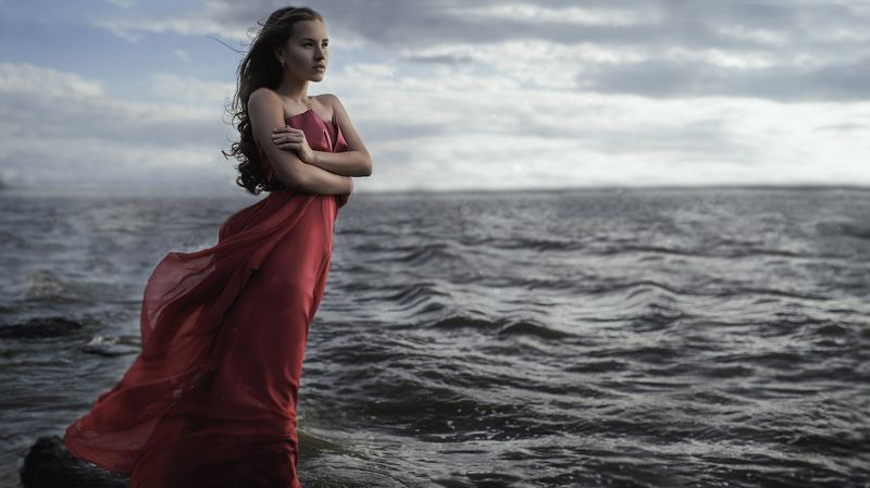 water longdress woman sea wind blue blond sunset rock Breezephoto preview