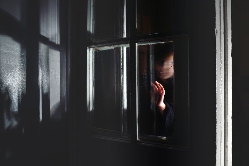 portrait; person; human; child; kid; children; childhood; hand; window; darkness; dark; indoors; light; mood; secret; fineart Darkness Touchphoto preview