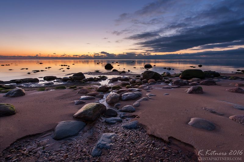 sea river seascape water sky clouds stone reflection sunset evening latvia The Bright Nightphoto preview