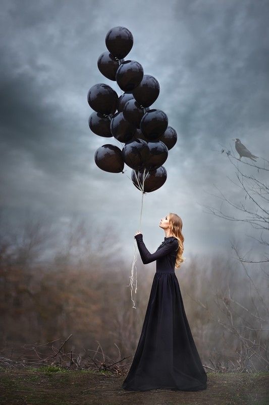 Girl with black balloonsphoto preview